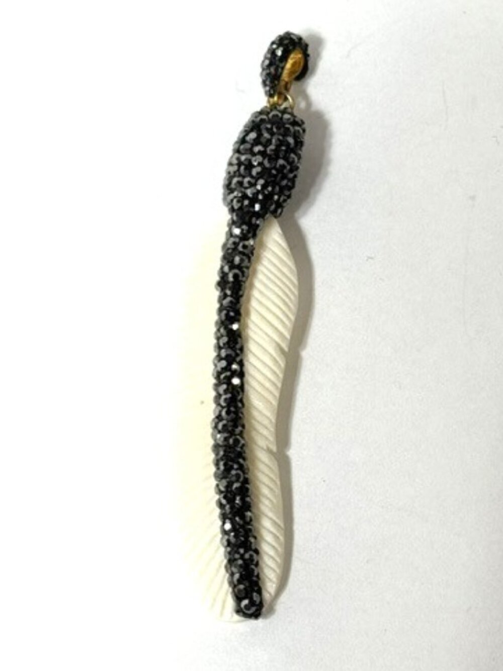 Vintage gun metal gray Swarovski crystal and lucite feather pendant.